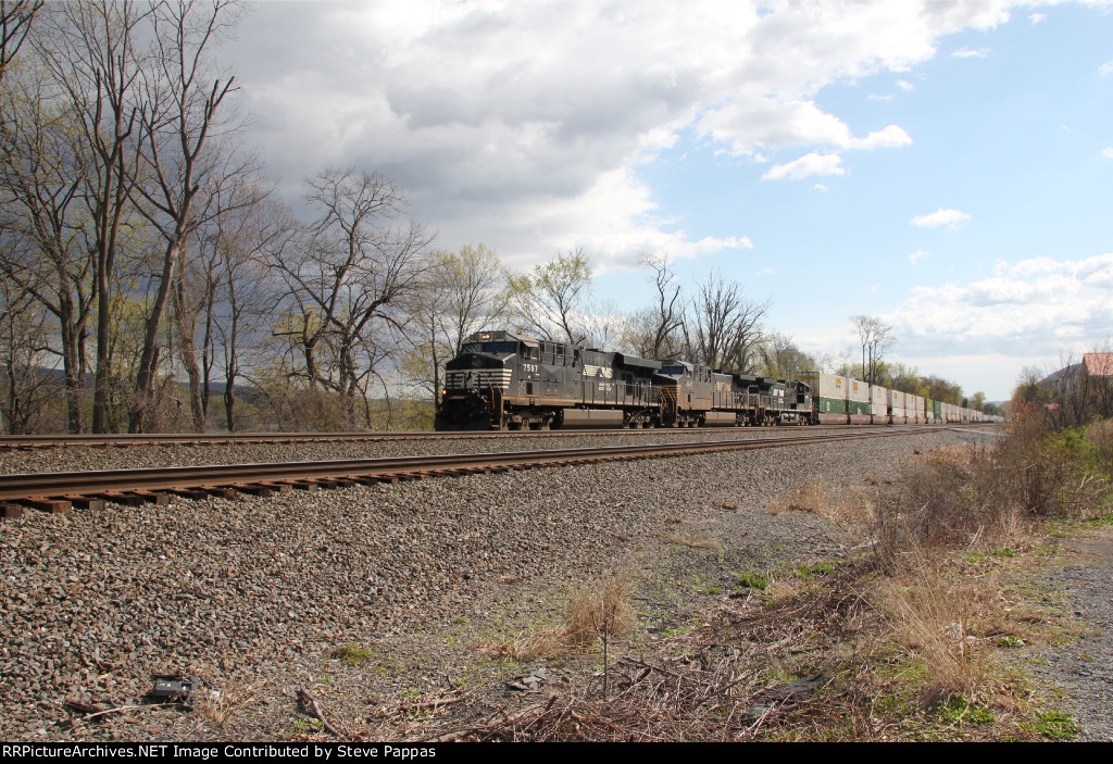 NS 7597 leads an intermodal train west through Cove PA